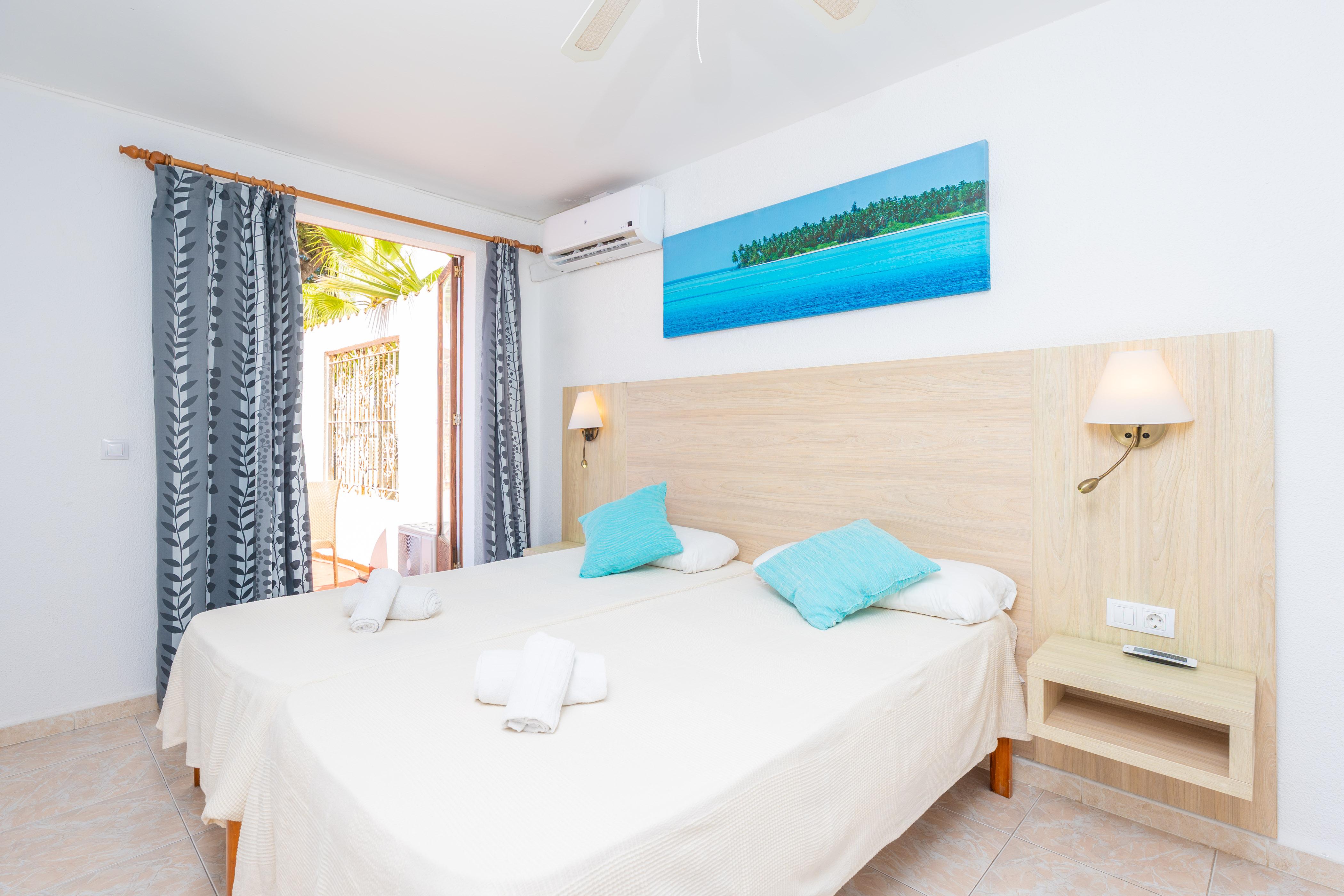 Outdoor terrace and garden at Hotel Antares Hab. Familiar in Spain